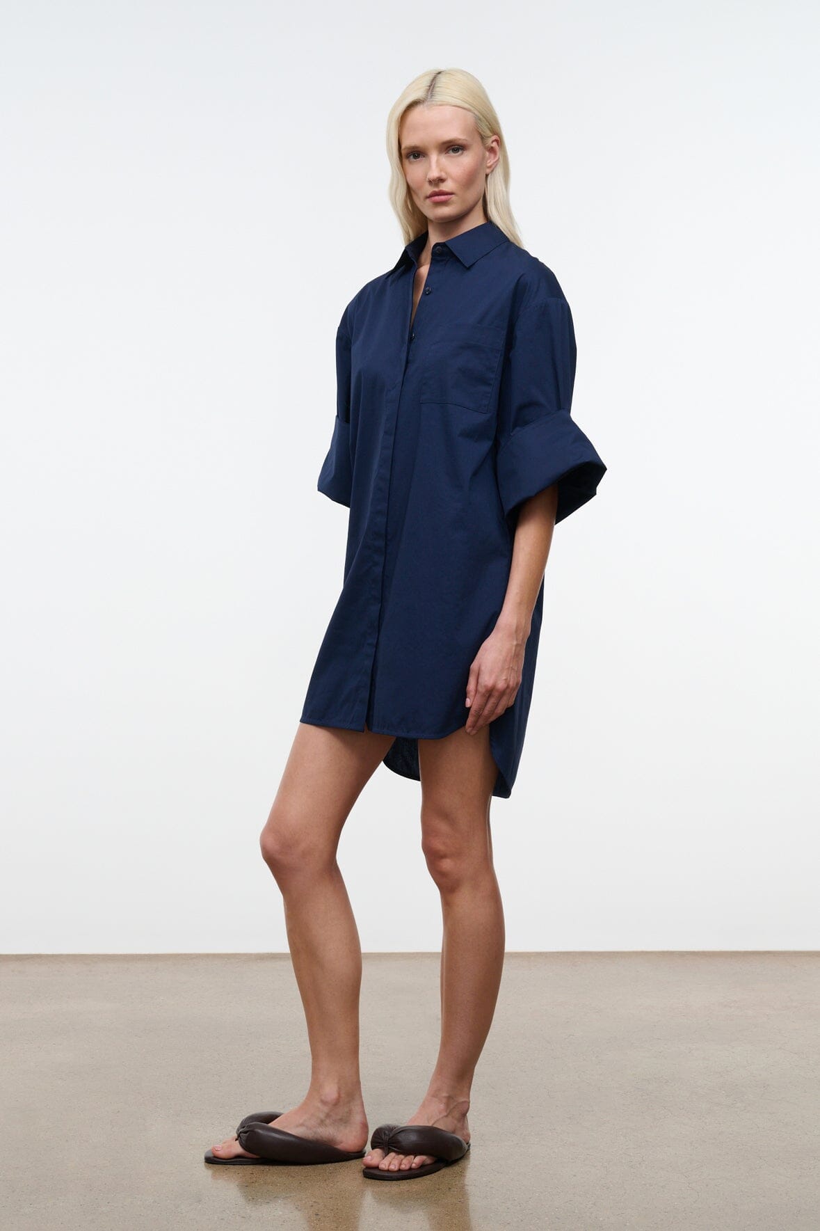 Navy button-front shirt dress with relaxed fit and short wide sleeves