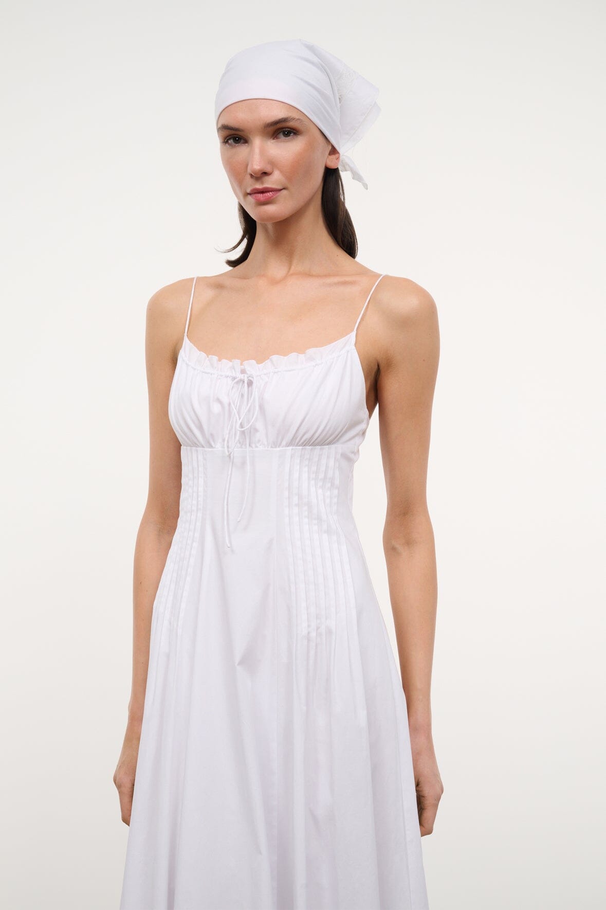 White spaghetti-strap maxi dress with gathered bust and ruched bodice