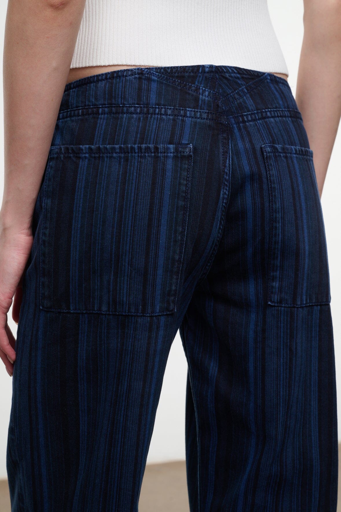 Women's dark navy striped wide-leg jeans, front view with patch pockets and stitched seams