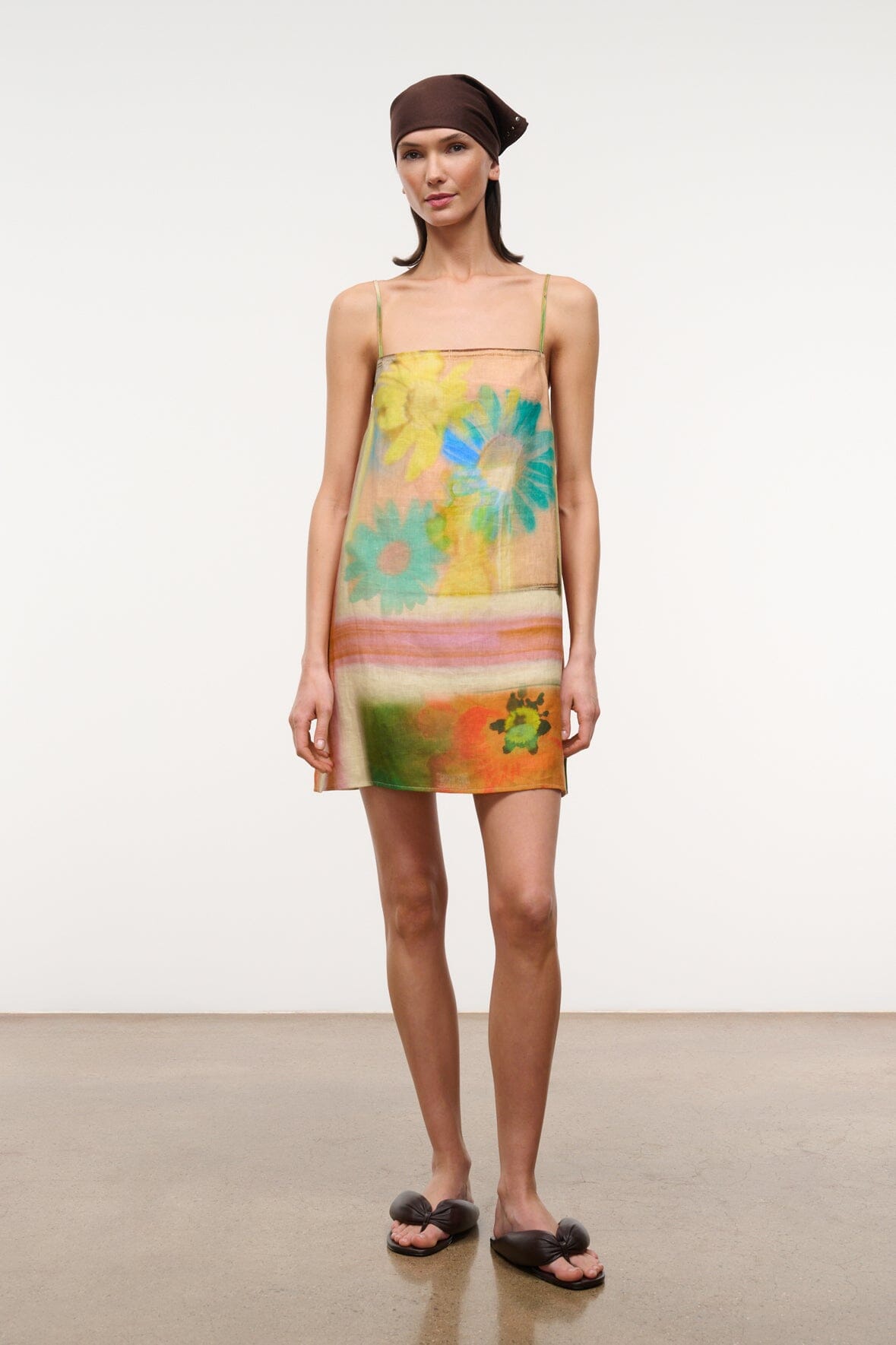 Front view multicolor floral linen mini dress with thin straps and above-knee length