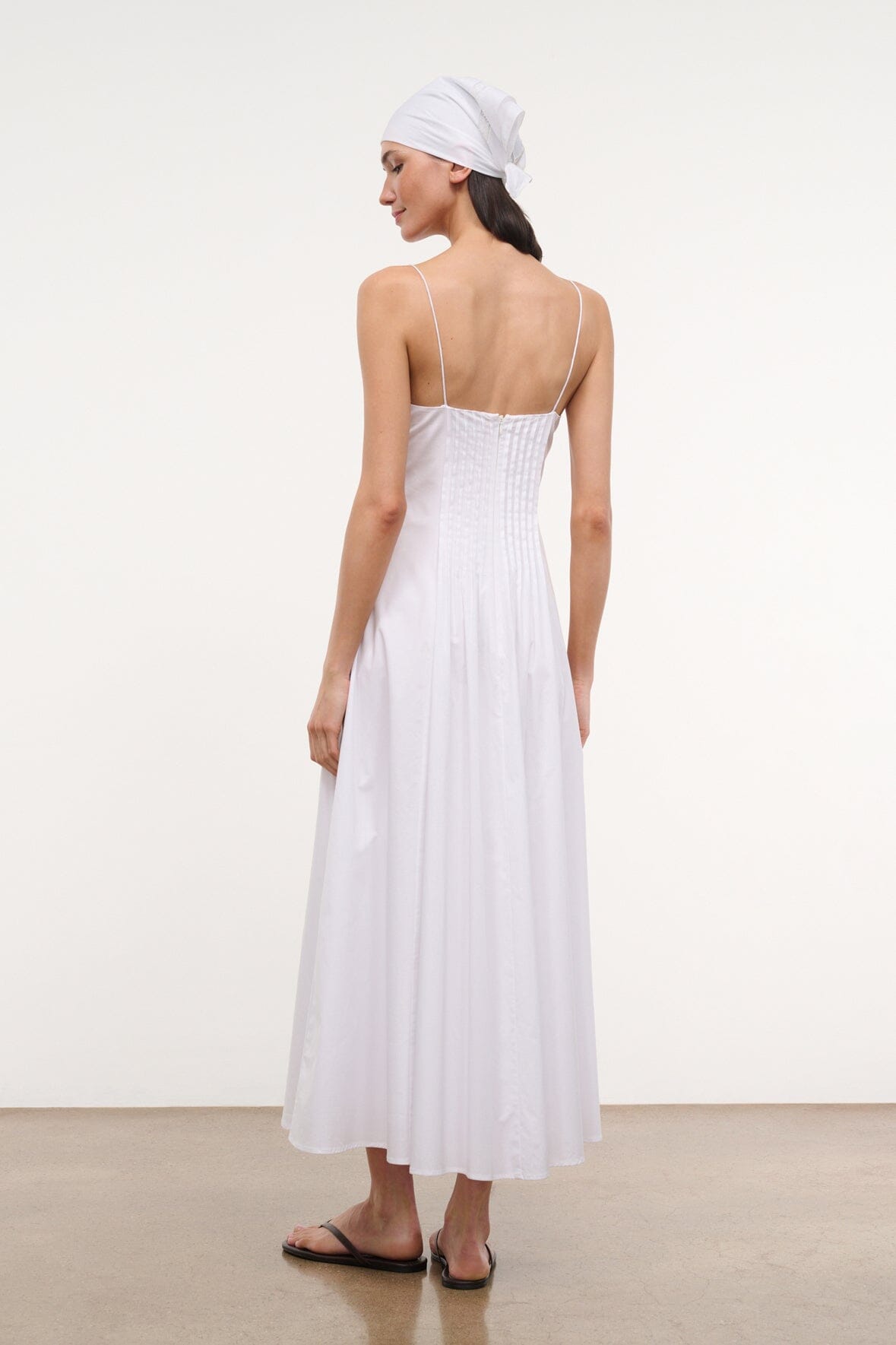 White spaghetti-strap maxi dress, open-back view