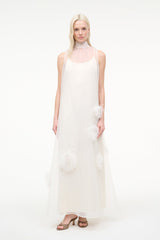 White sleeveless maxi dress with feather trim accents and flowy layered skirt