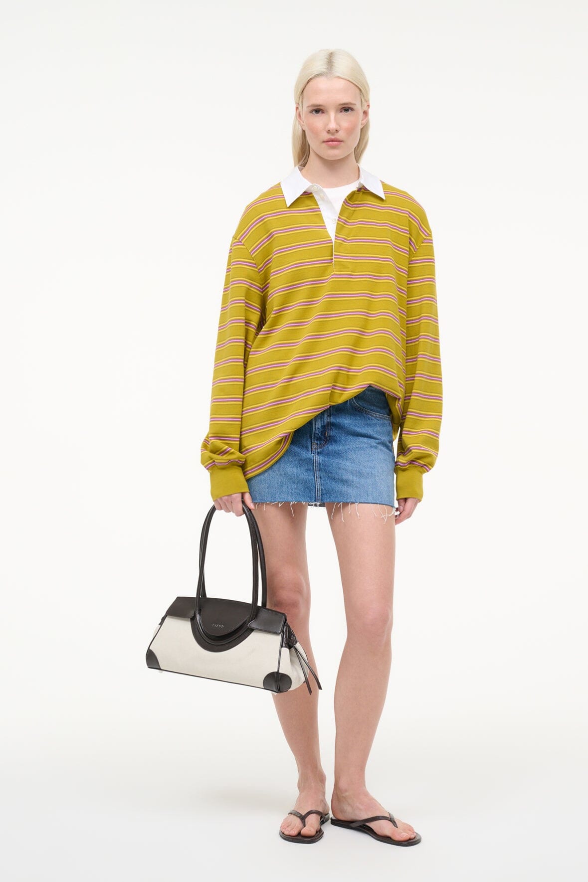 Maude shoulder bag carried by model: natural canvas with espresso leather trim