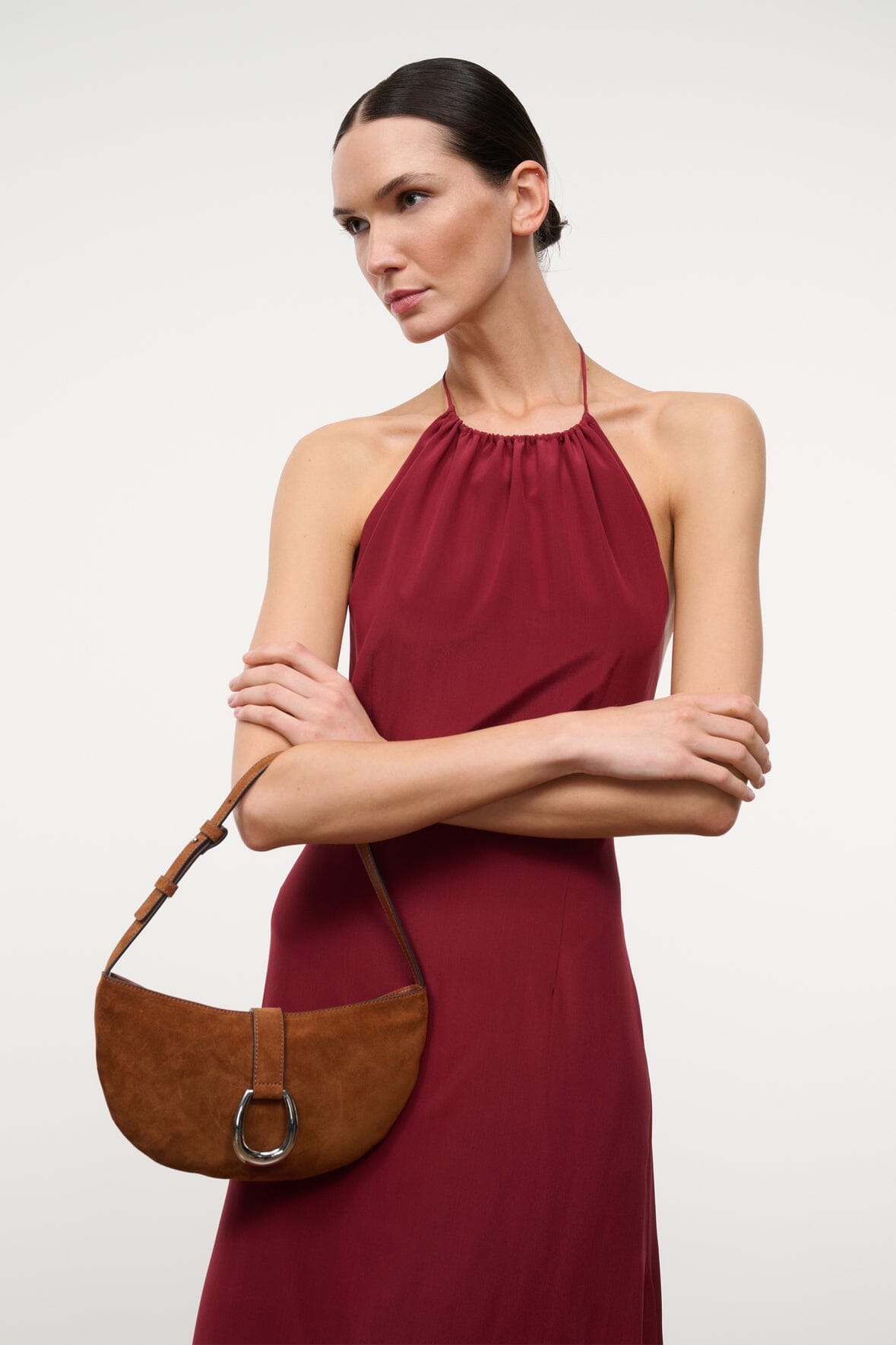Tabac suede shoulder bag with ring clasp, held across the body