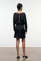 Black silk mini dress with long sleeves, ruched back detail