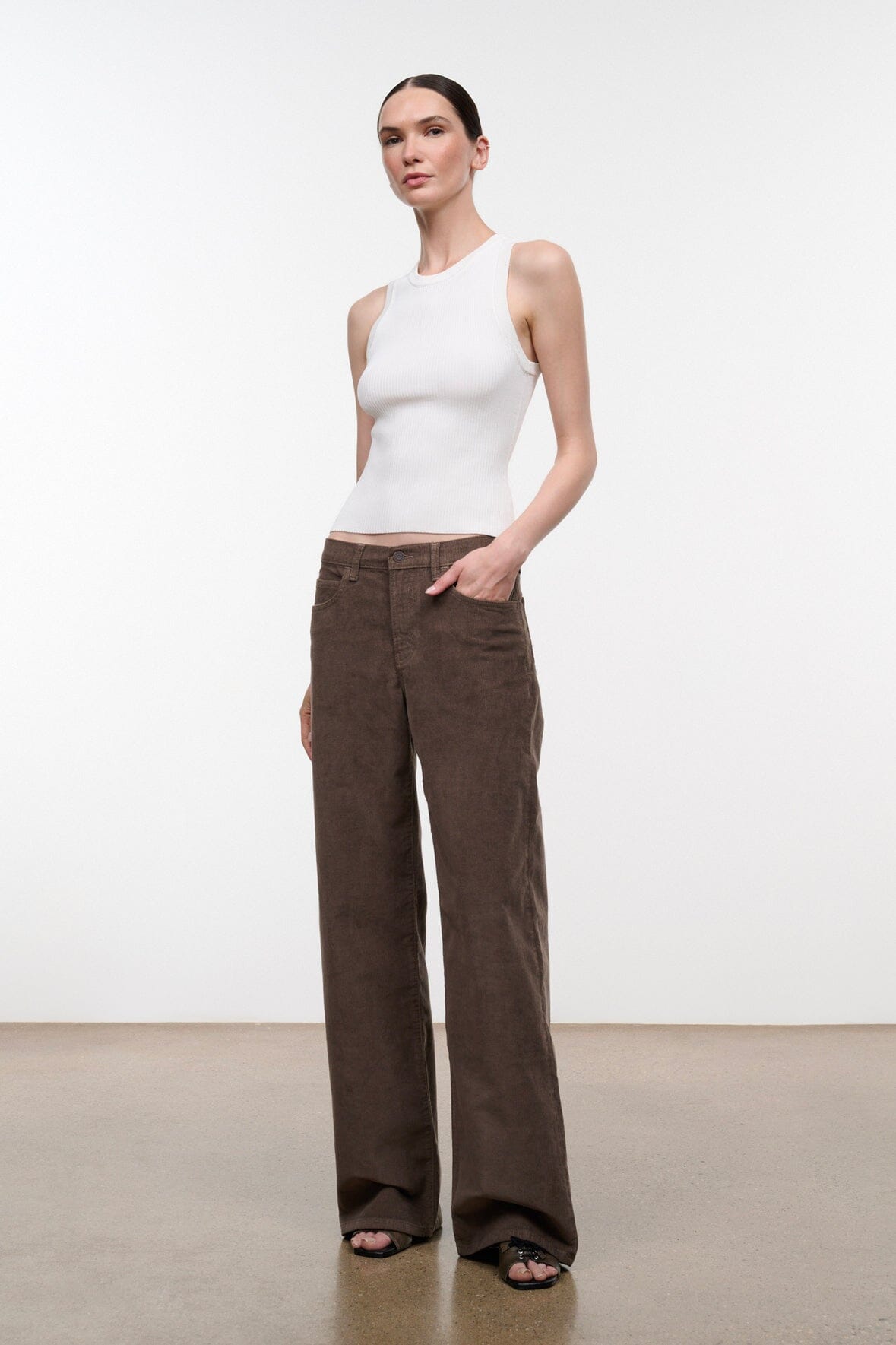 Relaxed corduroy jeans in dark brown, wide leg silhouette, front button fly, side pockets