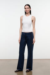 Women's dark navy striped wide-leg jeans, front view standing with straight wide pant legs