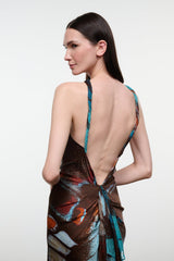 Silk halter dress back view with crisscross tie straps and multicolor abstract pattern