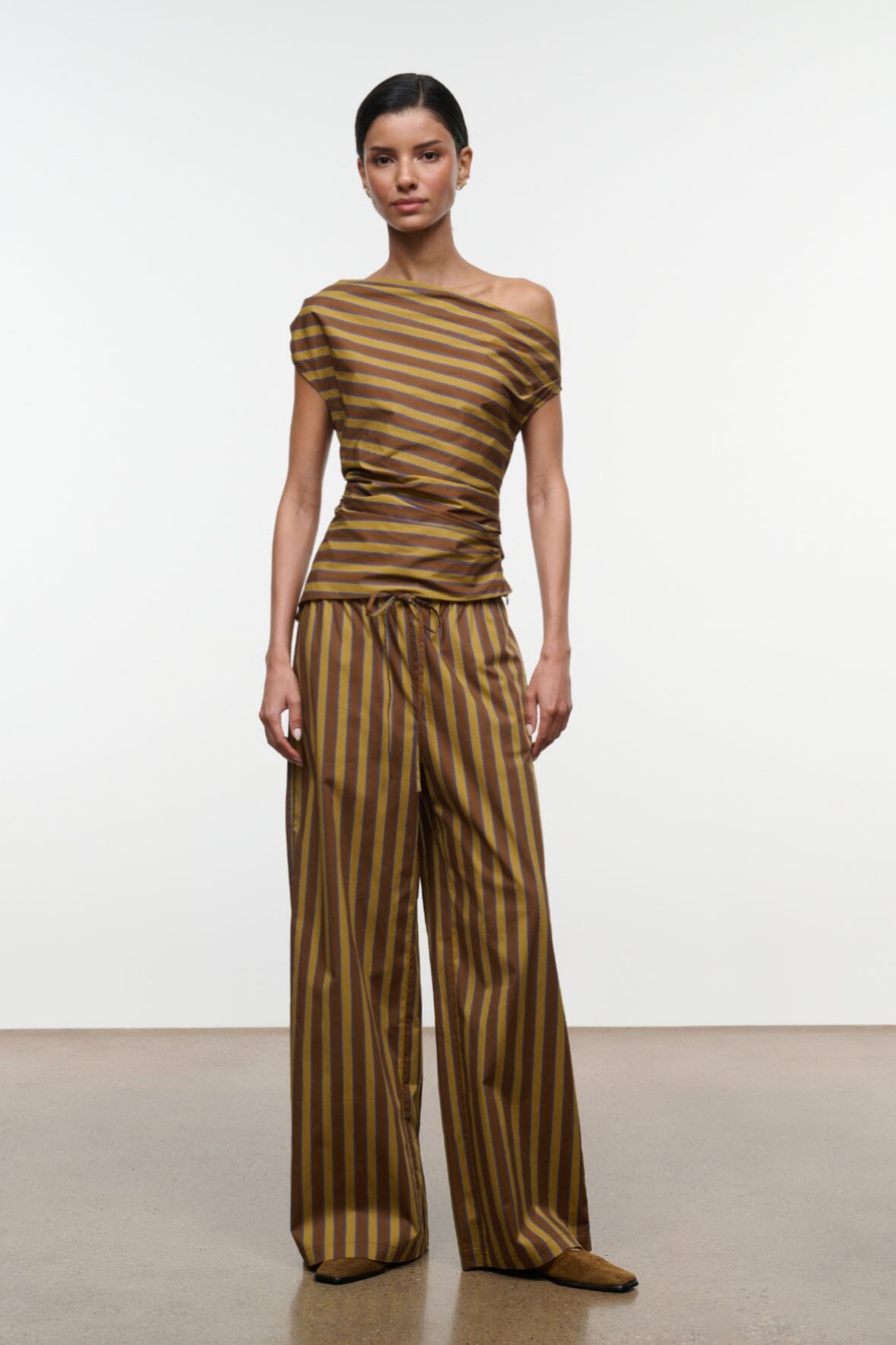 Front view wide-leg striped pants with drawstring waist, vertical brown and teal stripes