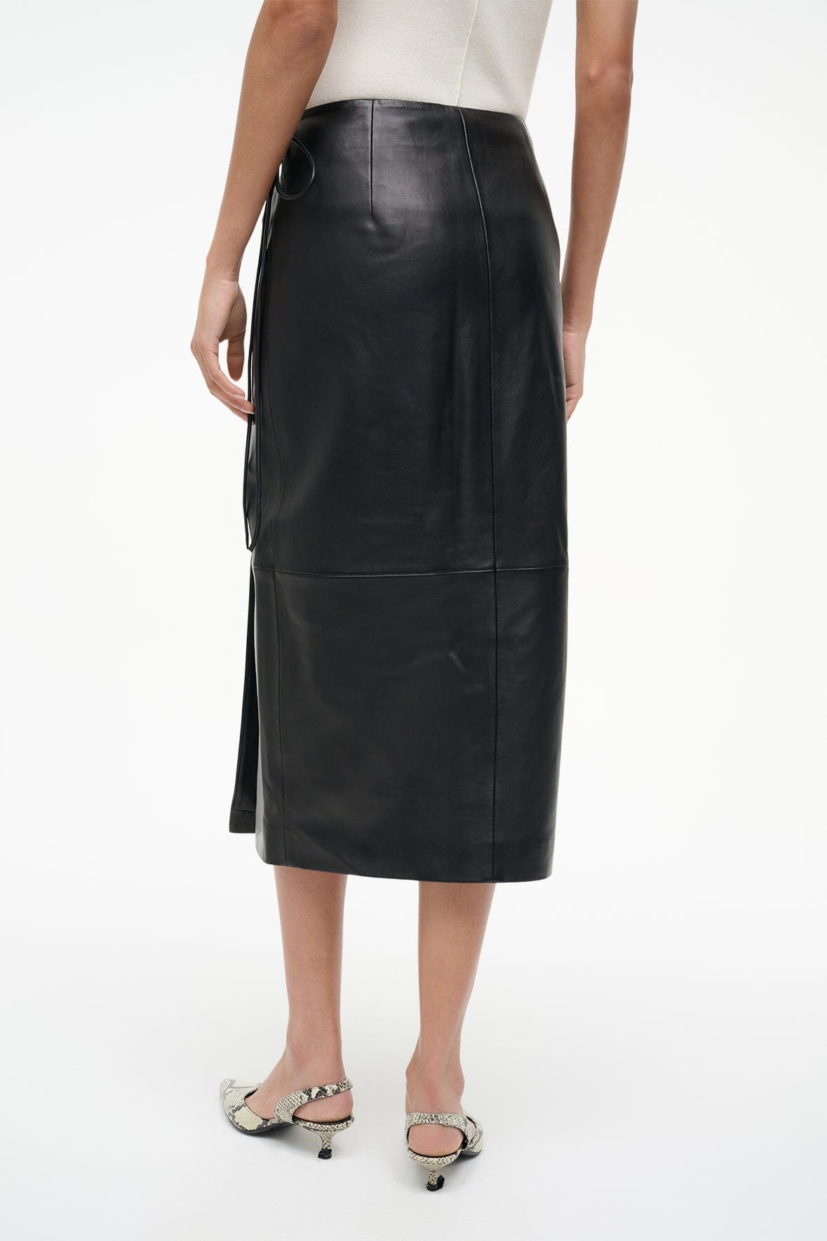 Black leather wrap midi skirt, front view with side slit
