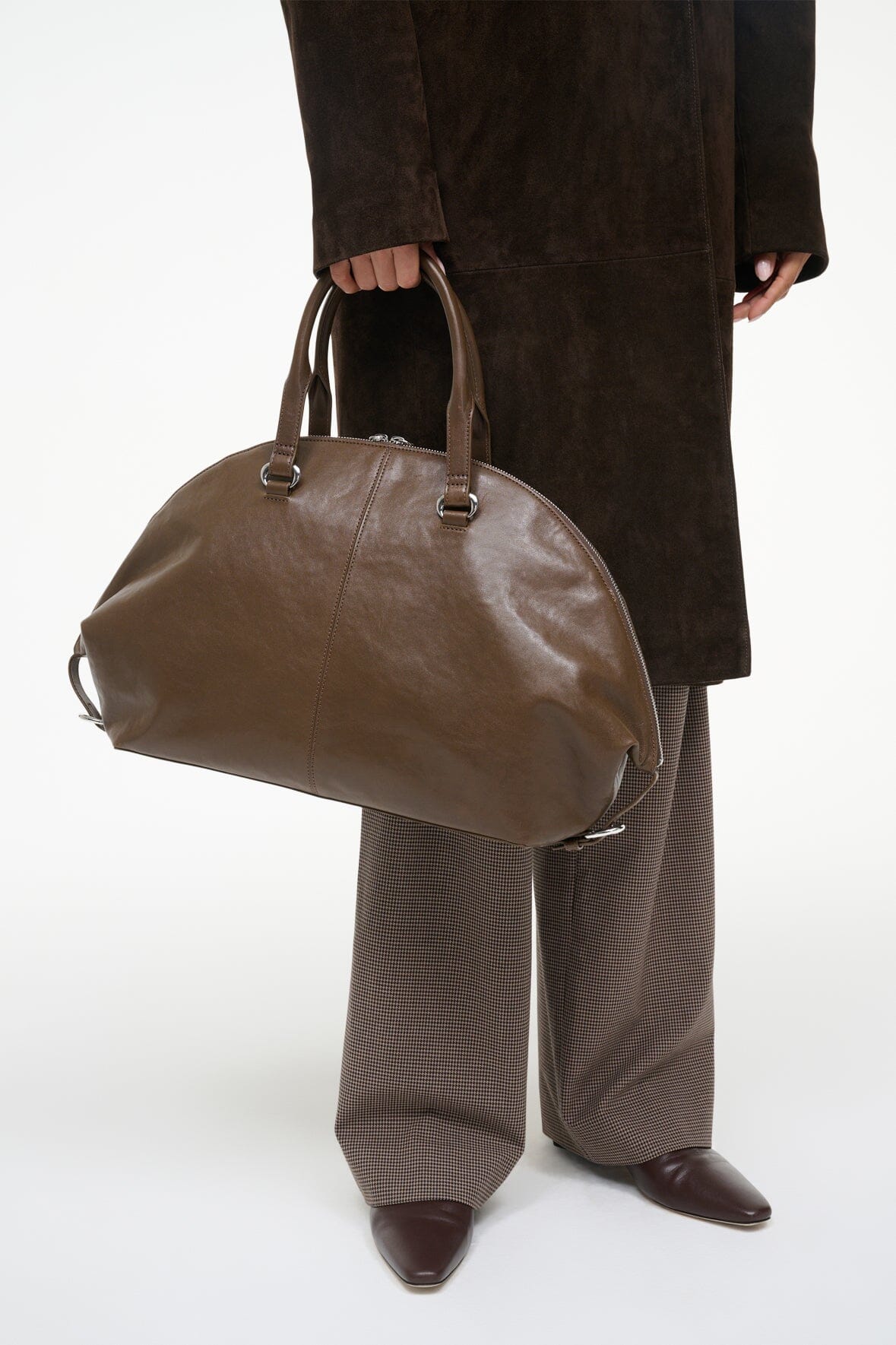 Truffle brown leather-look satchel with top handles and zip closure.