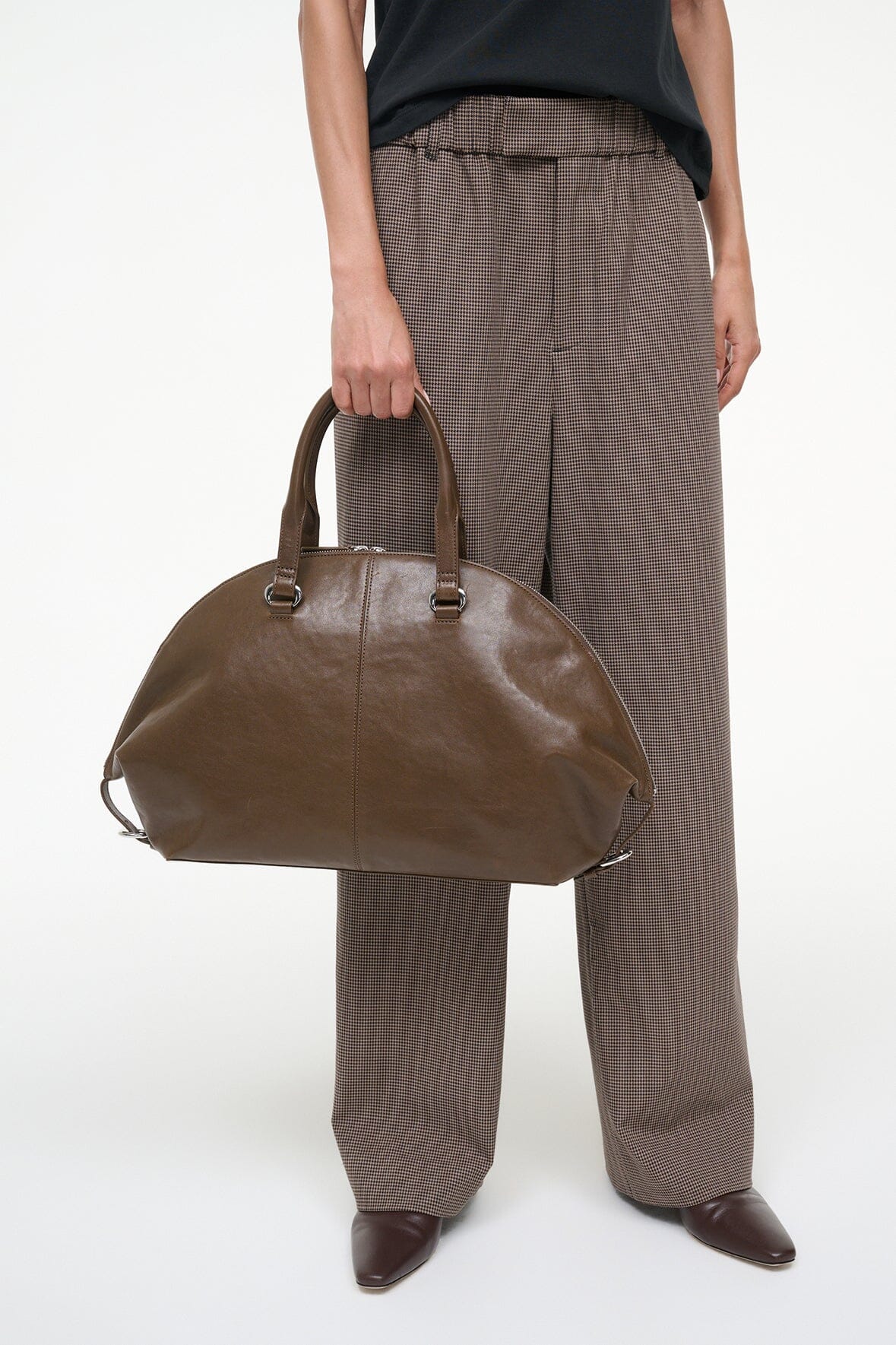 Truffle brown satchel with two top handles and zip closure.