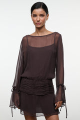 Dark brown sheer long-sleeve mini dress with gathered ruched waist and tie-cuff sleeves.