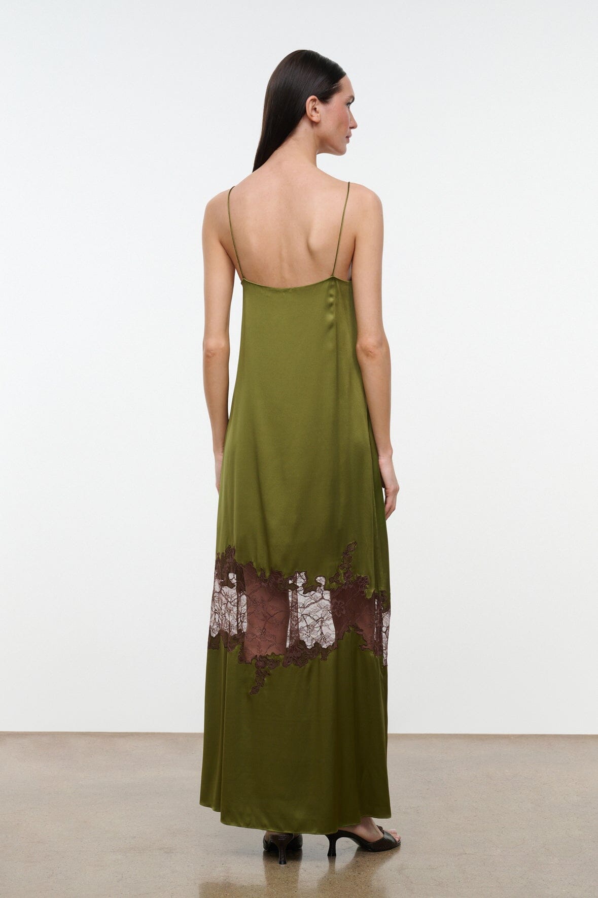 DELFINA silk dress in olive green with spaghetti straps and lace hem detail at back