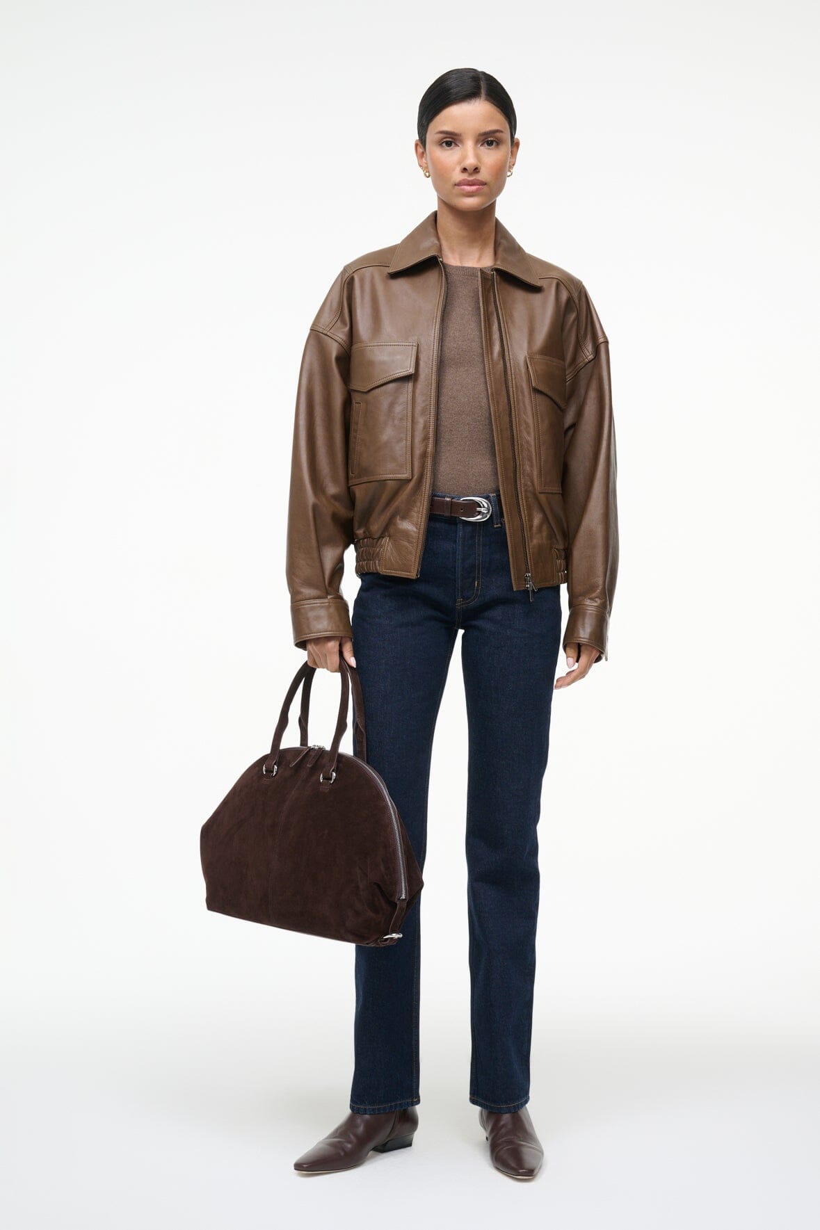 Women’s brown leather bomber jacket with front zipper and flap chest pockets