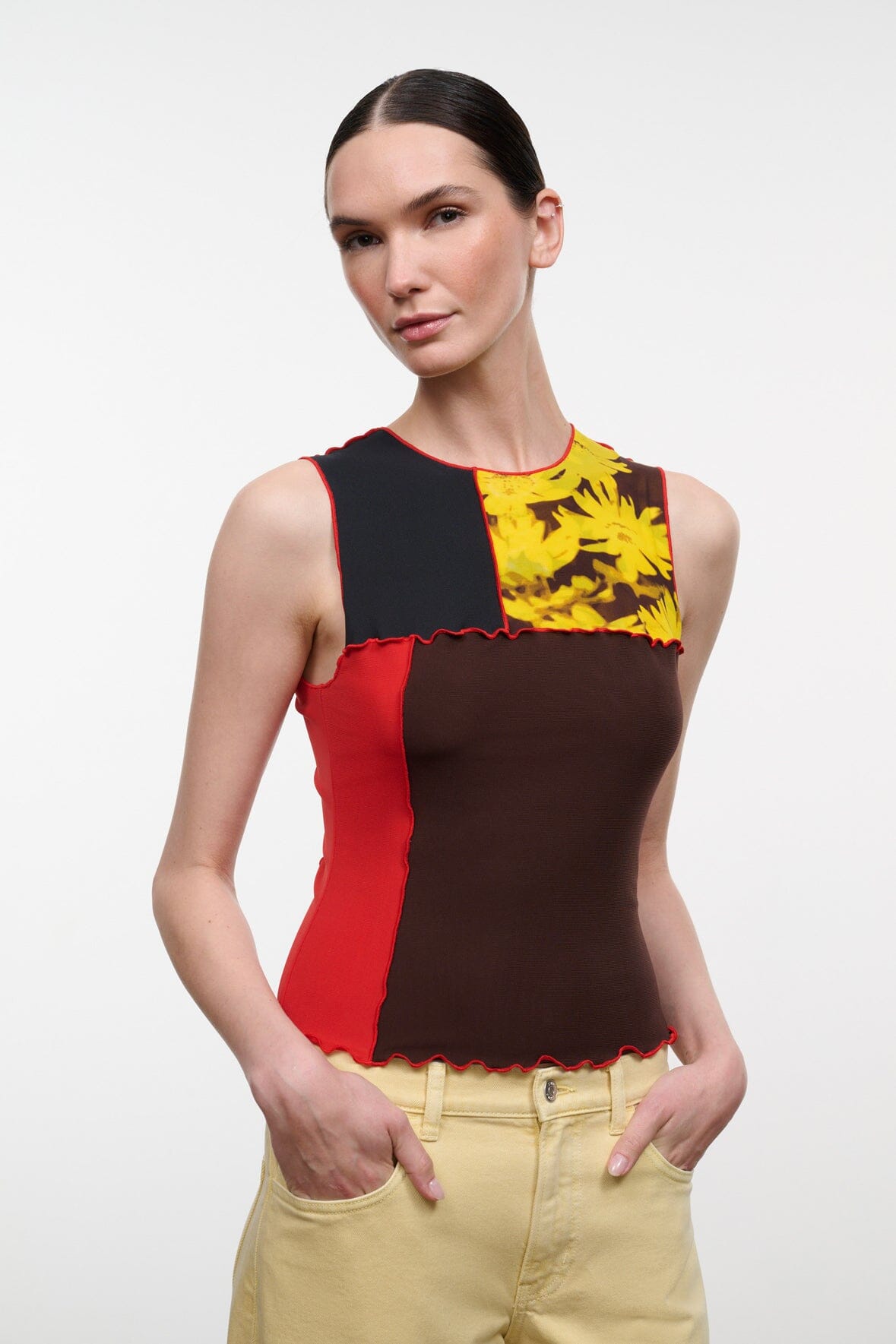 Sleeveless floral print top, dark brown front panel with yellow flowers and red side panels