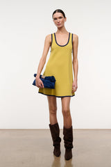 Brown suede slouch boots with ruched shaft and stacked heel on model