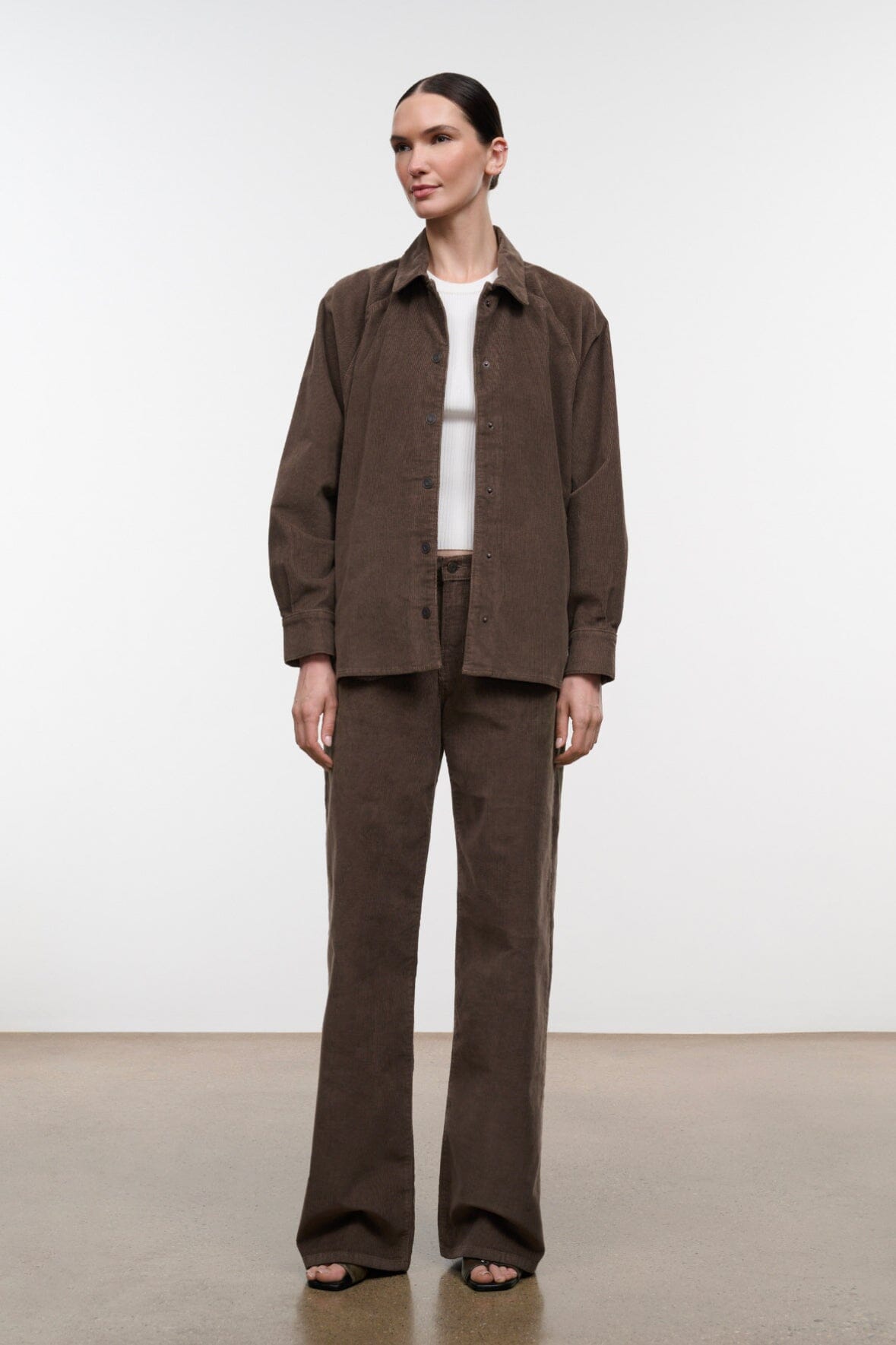 Relaxed dark brown corduroy jeans, straight-to-wide leg, button fly, belt loops