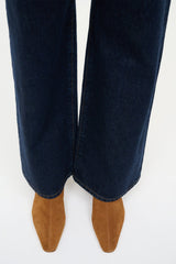 Tan suede ankle boots worn with dark blue jeans, low block heel