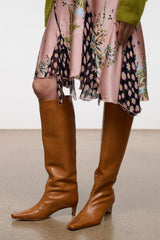 Cashew brown tall leather pull-on boots with pointed toe