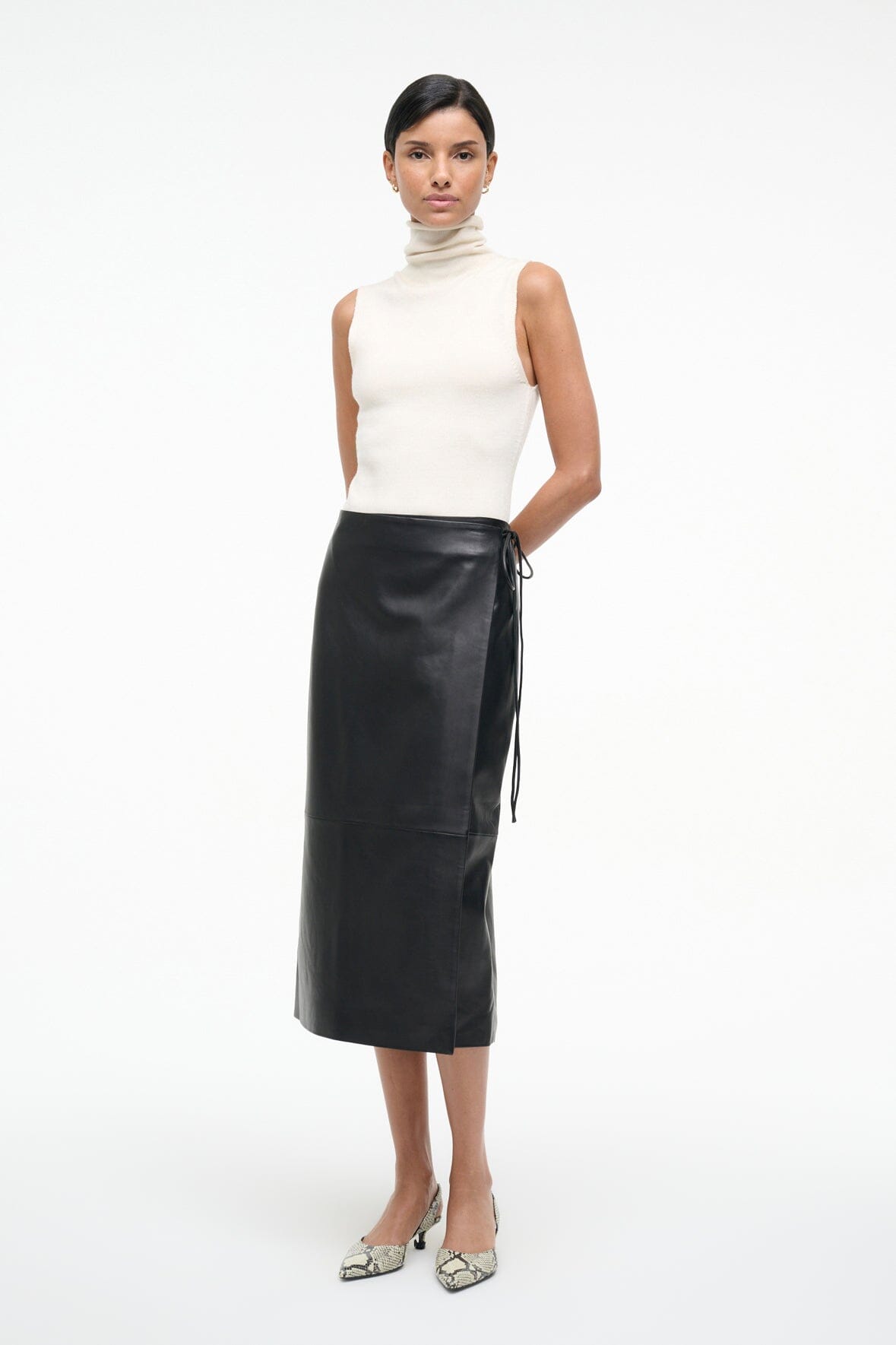 Black leather wrap midi skirt with side-tie detail at waist