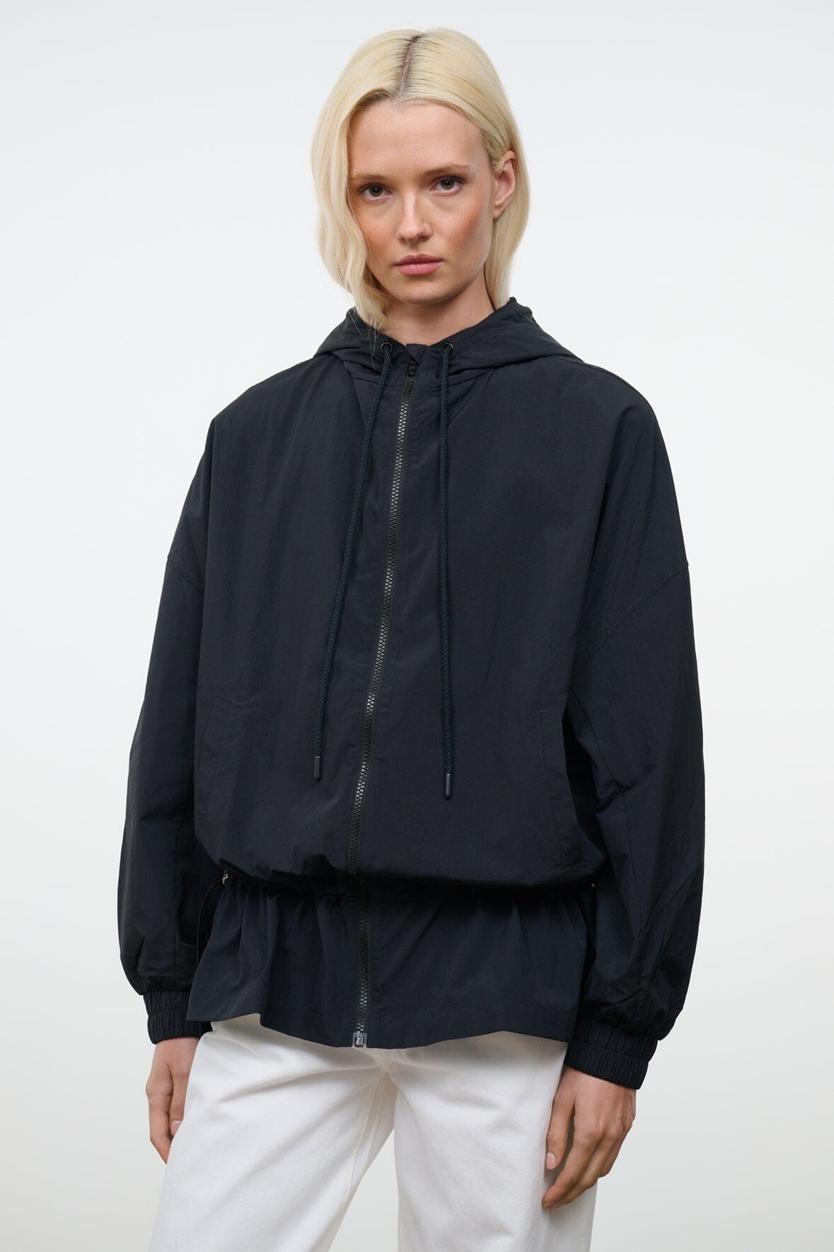 Black hooded wind jacket with front zip and adjustable hood strings