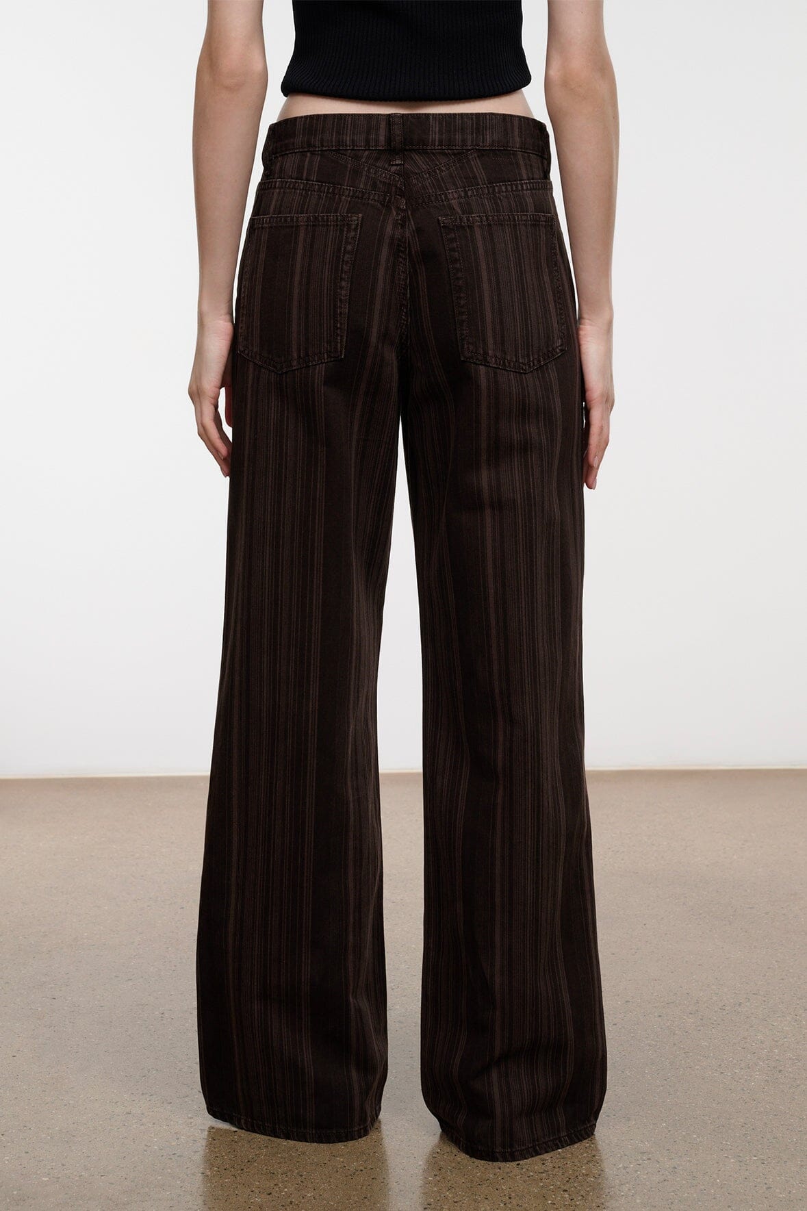 Dark brown espresso-striped relaxed jeans, wide-leg back view with center seam