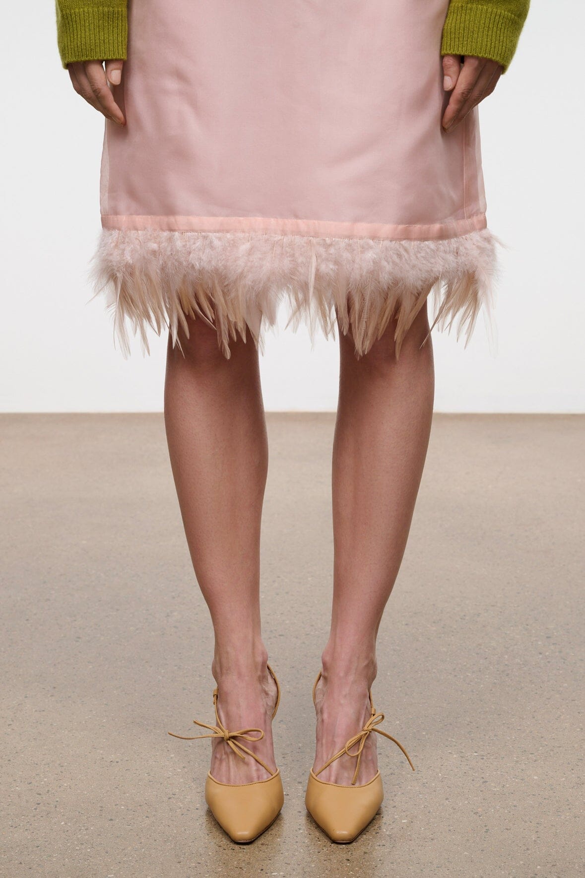 Cashew heeled pumps, lace-up ankle ties with small bow, on model