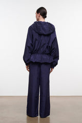 FLO pants in dark navy with wide legs, back view showing elastic waistband