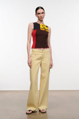 Sleeveless floral print top with dark brown body, yellow flowers, red trim and scalloped hem
