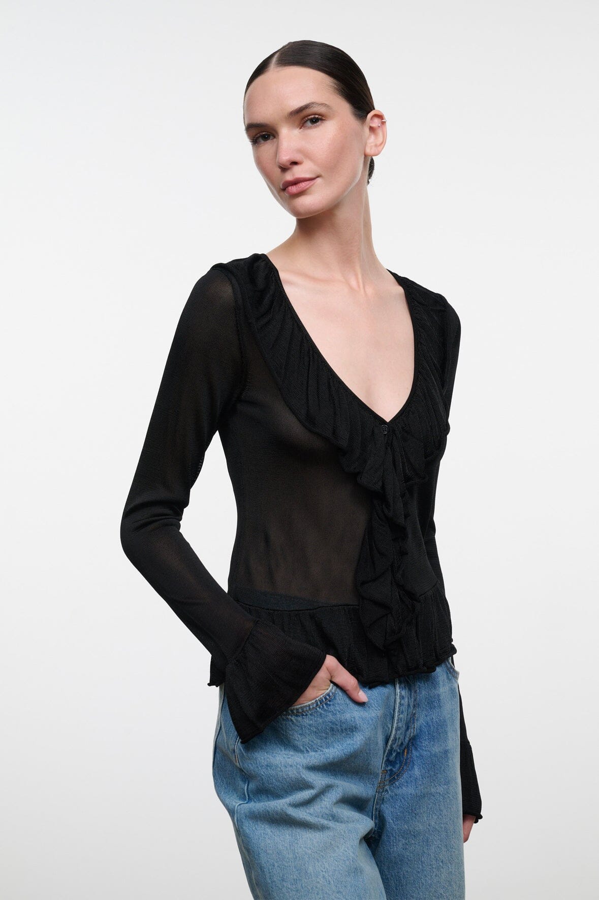 Black V-neck long-sleeve top with front ruffle and gathered cuffs
