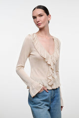 Champagne ruffle V-neck top with layered front ruffles and long cuffed sleeves