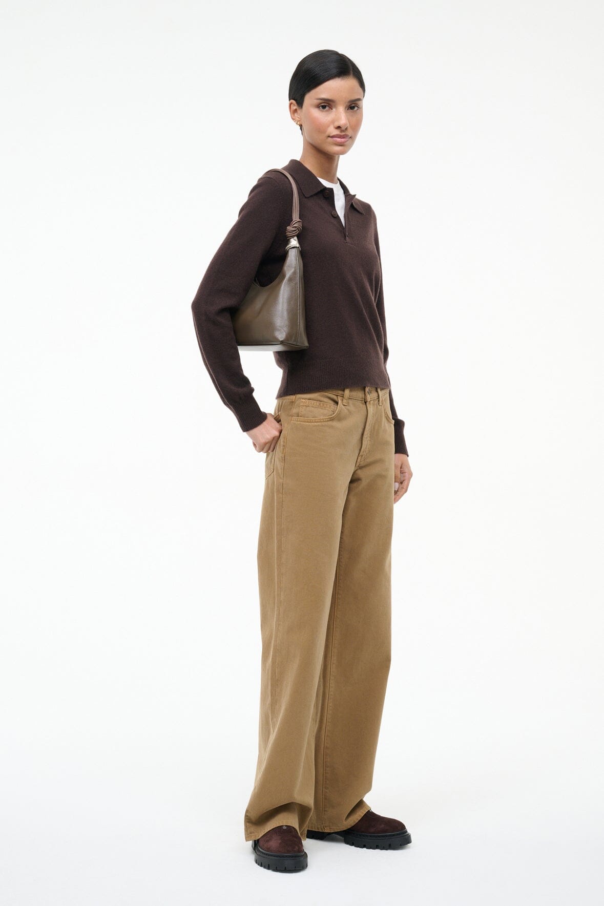 Truffle brown slouchy shoulder bag with braided handles and silver hardware, worn by model