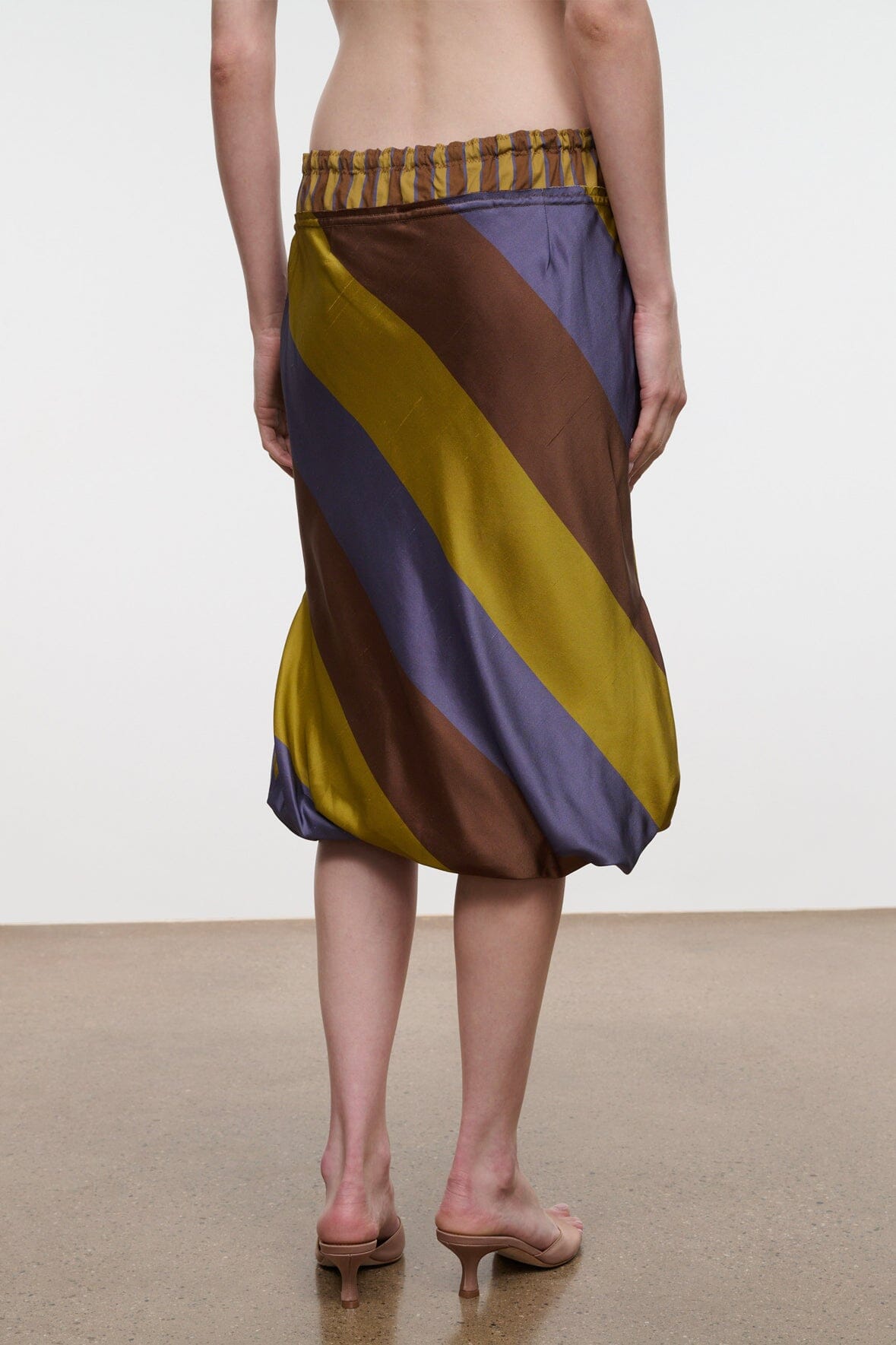 Silk midi skirt with elastic waist and tie, flowing diagonal stripes in yellow, brown, navy