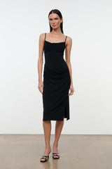Black draped midi dress with spaghetti straps and cowl neckline