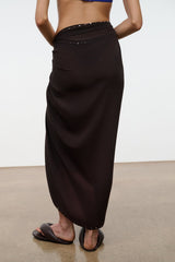 Brown long sarong wrap skirt with draped front and studded waistband edge
