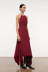 Silk halter dress dark red with fitted waist and uneven wrap-like hem