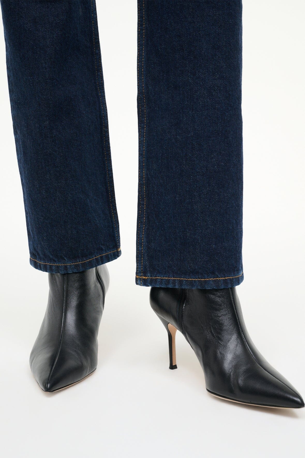 Black leather ankle boots with slim heel and pointed toe