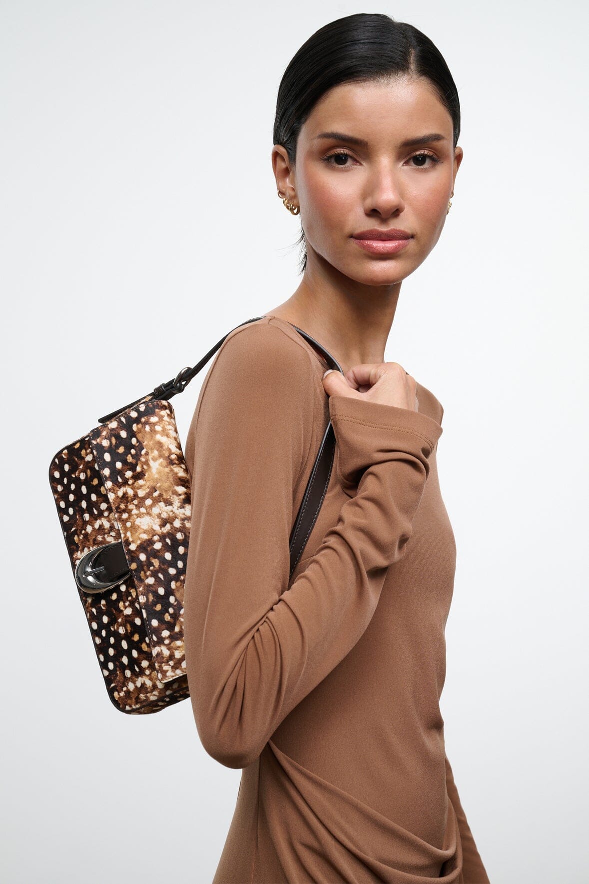 Brown and black speckled haircalf shoulder bag with top handle and flap, side view