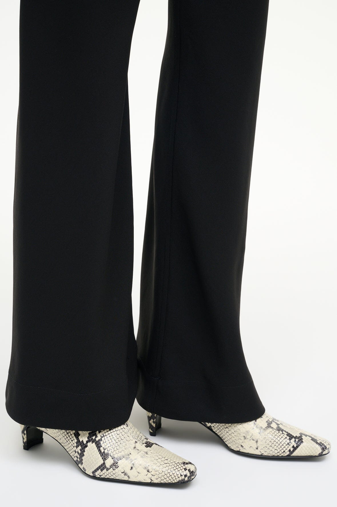 Snake-print white ankle boots with low block heel and pointed toe