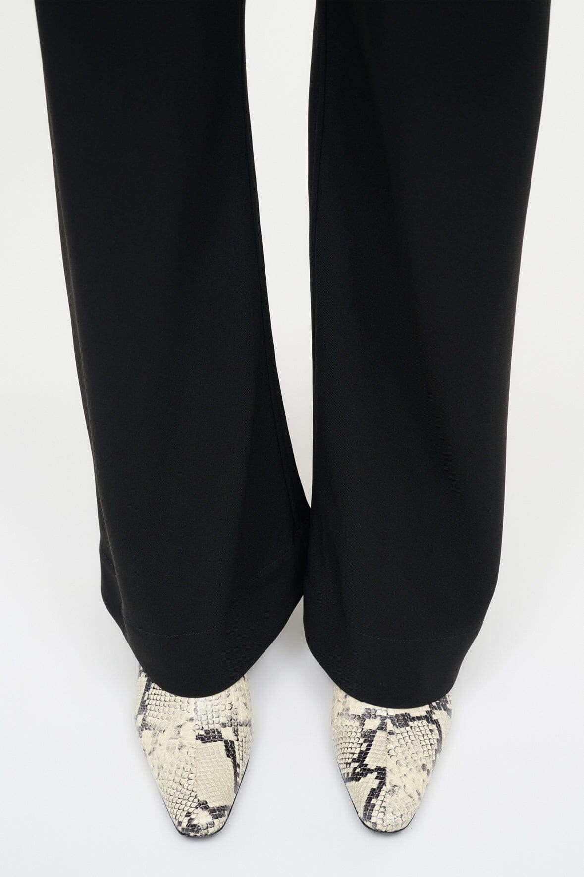 White snake-print ankle boots with low heel and pointed toe