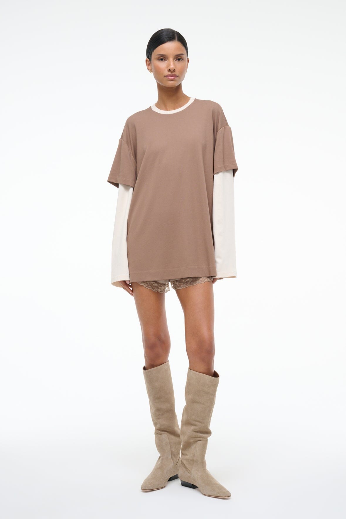 Taupe oversized short-sleeve tee with lace-trim hem and visible white long-sleeve underlayer