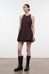 Dark brown sleeveless mini dress, side view, gathered waist and tied side seam
