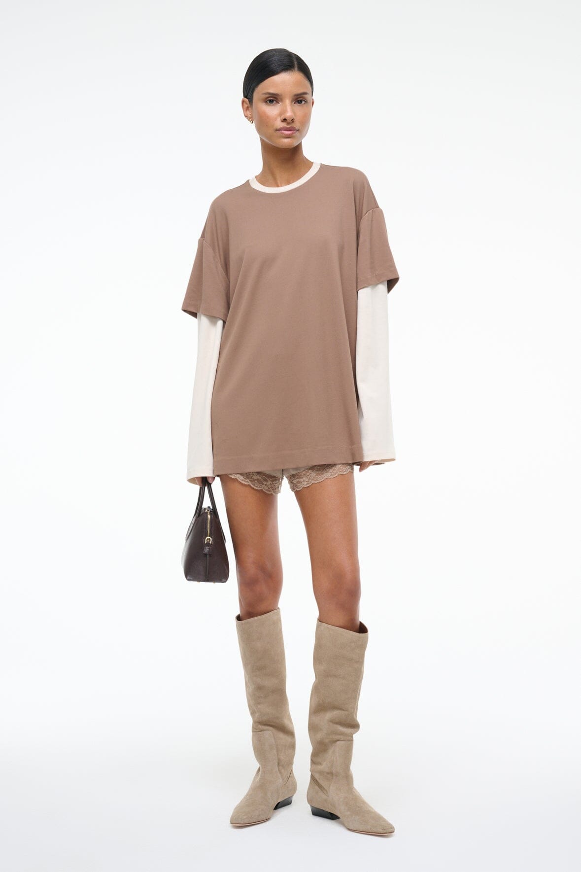 Taupe short-sleeve tee with lace-trim hem and white long-sleeve underlayer, full-length view