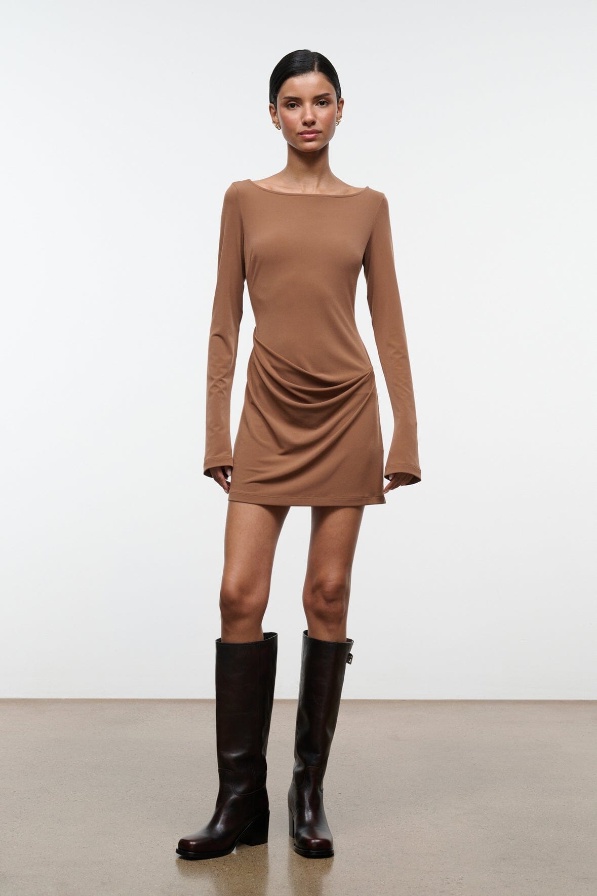 Tall dark leather boots with low block heel and side pull-on opening