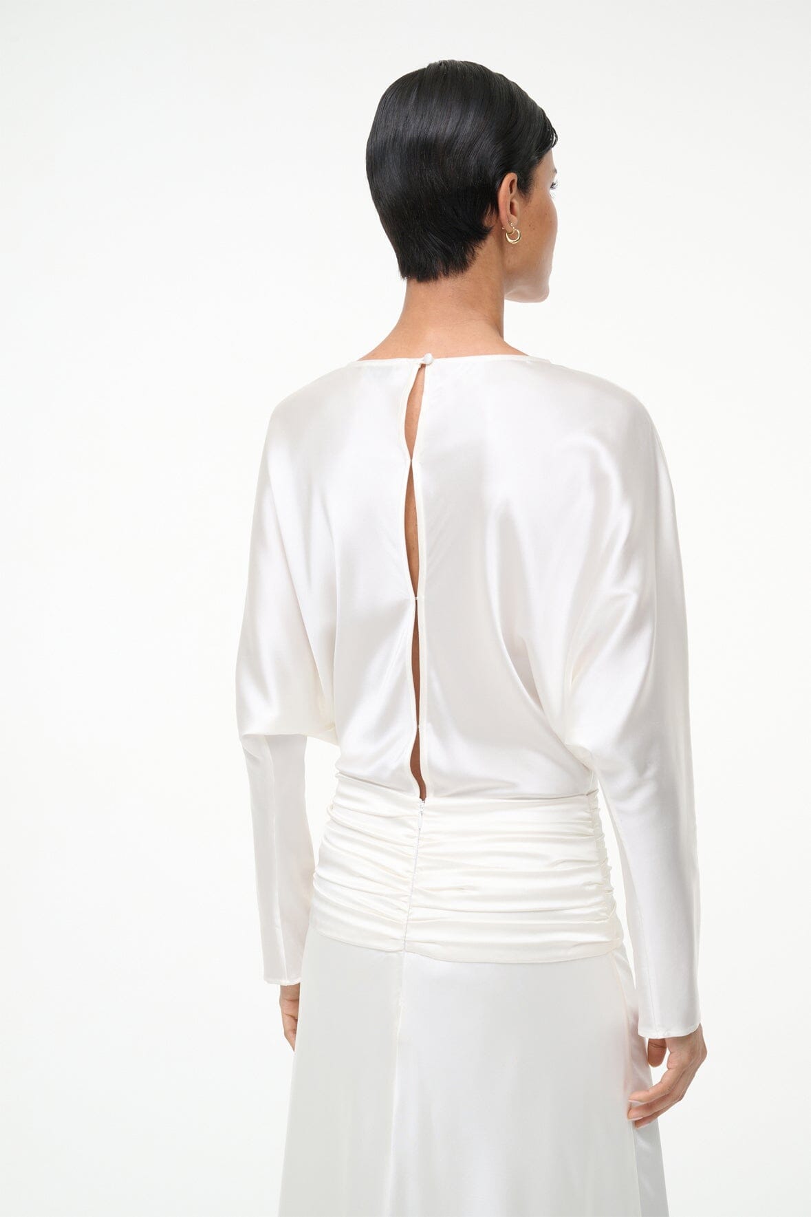 Ivory silk dress with back keyhole opening and long sleeves, gathered waist