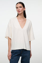 Ivory V-neck short-sleeve tee with relaxed, draped fit