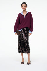 Espresso satin slingback ballet heels on model with burgundy top and sequined skirt