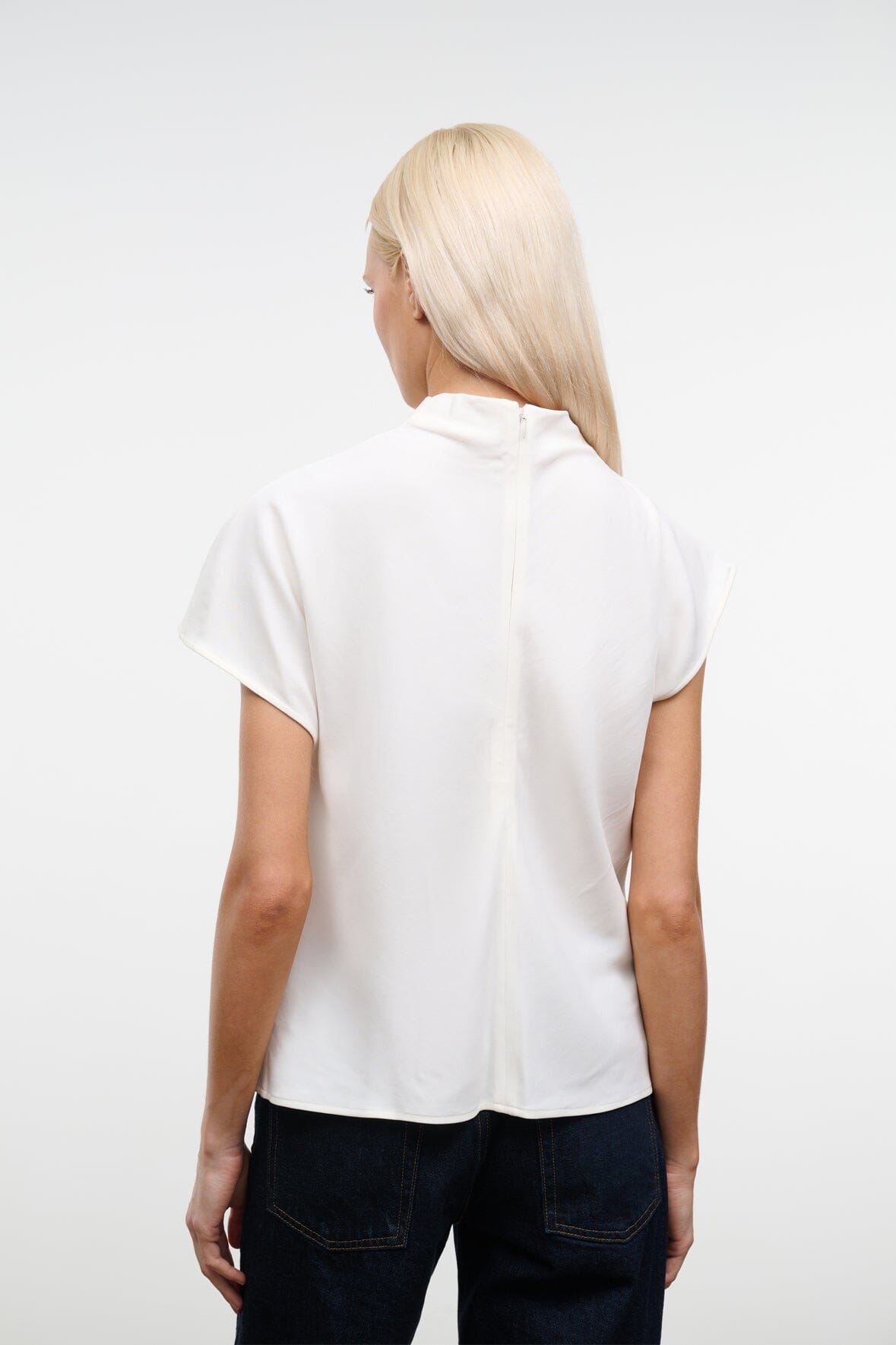 Ivory top with high back neck and wide short sleeves, relaxed fit