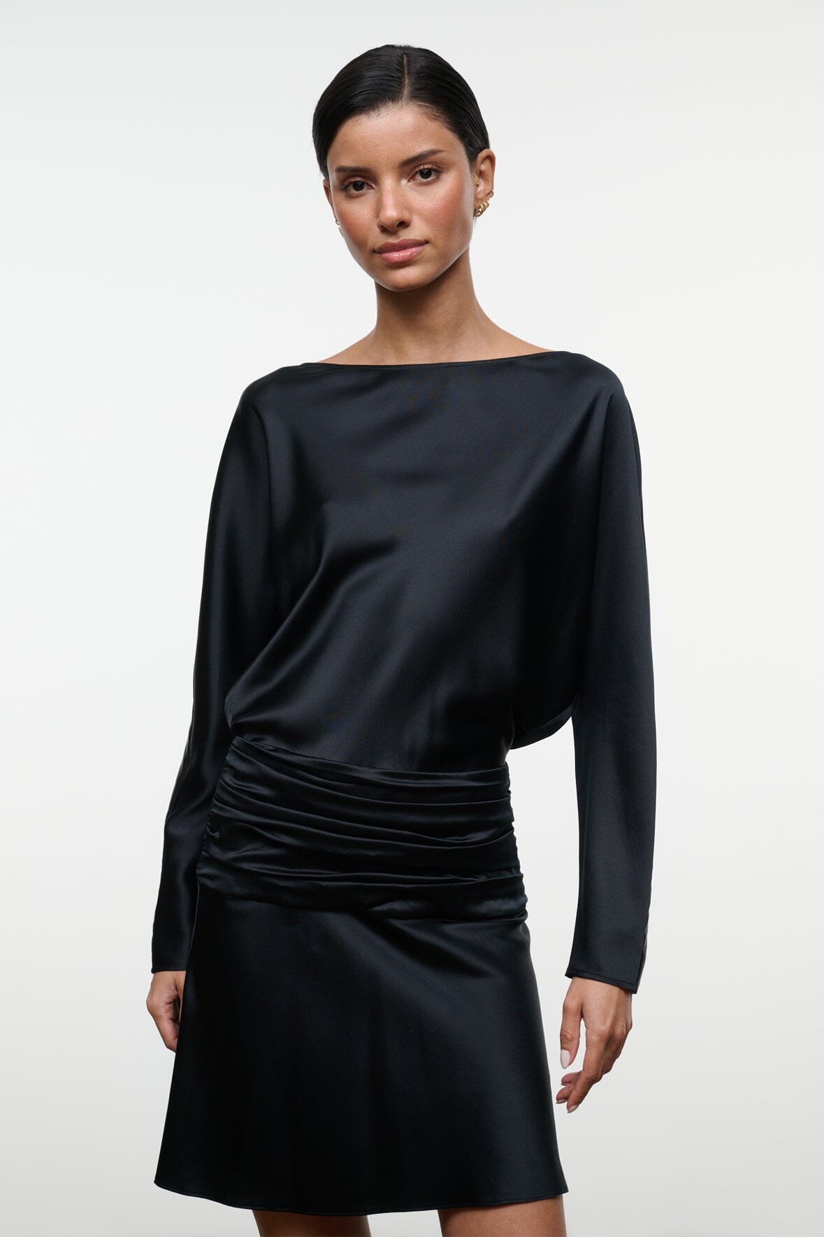 Black silk mini dress close-up, long sleeves and ruched waist gathering